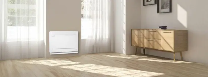 Floor-mounted air conditioning unit in a modern living room with natural light