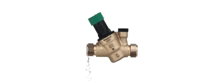 Pressure relief valve dripping water due to excess boiler system pressure.