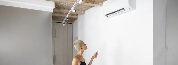 Wall-mounted air conditioning unit installed in a modern living room